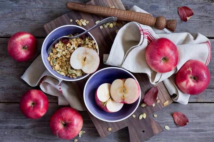 Apples and Muesli on a Wooden Table