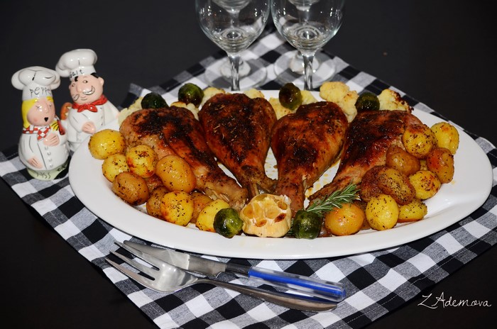 Roasted chicken legs with potatoes and Brussels sprouts
