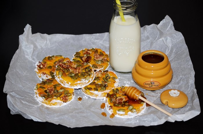 Pastries with pumpkin, seeds, nuts, milk, and honey