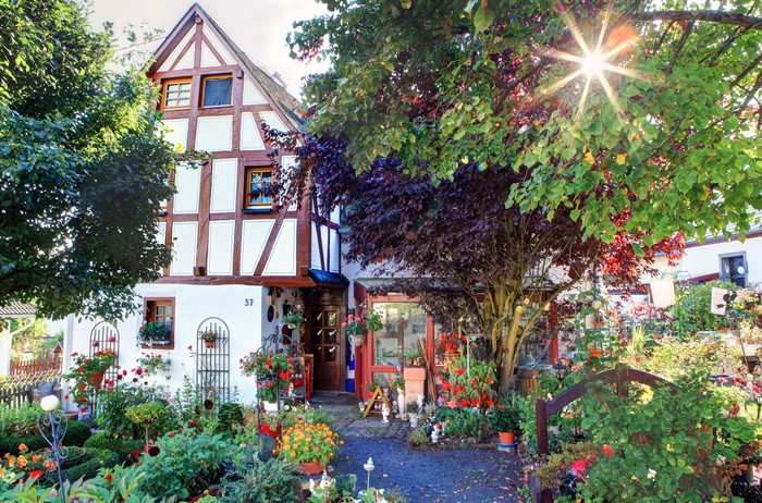 Half-timbered house with a lush garden in Germany