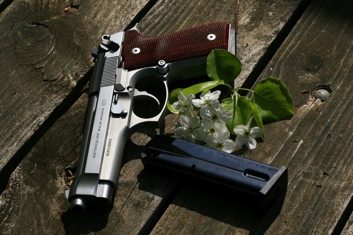 4K Beretta pistol with magazine and flowers