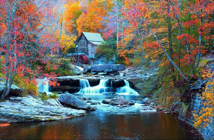 Autumn waterfall and old mill at Babcock State Park, USA