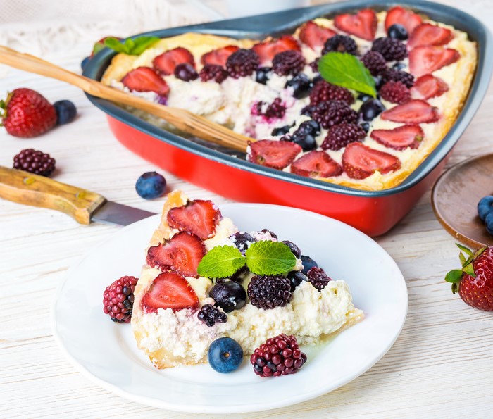 Heart-shaped berry pastry with strawberries and blueberries