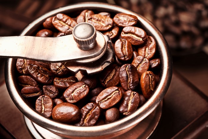 Coffee beans in a grinder
