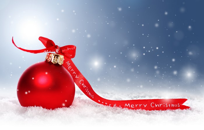 Red Christmas Ornament with Merry Christmas Ribbon in Snow