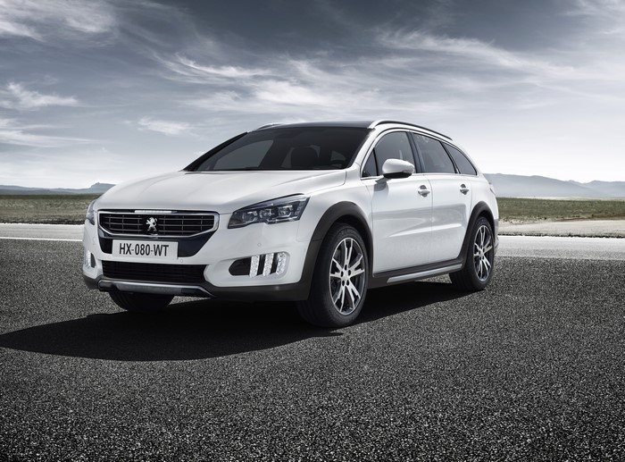 White Peugeot 508 RXH Hybrid4 parked on asphalt road