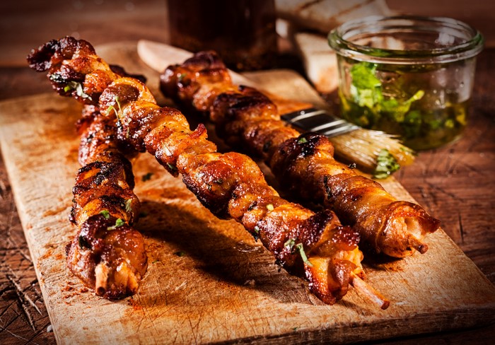 Meat products shashlik on a wooden board
