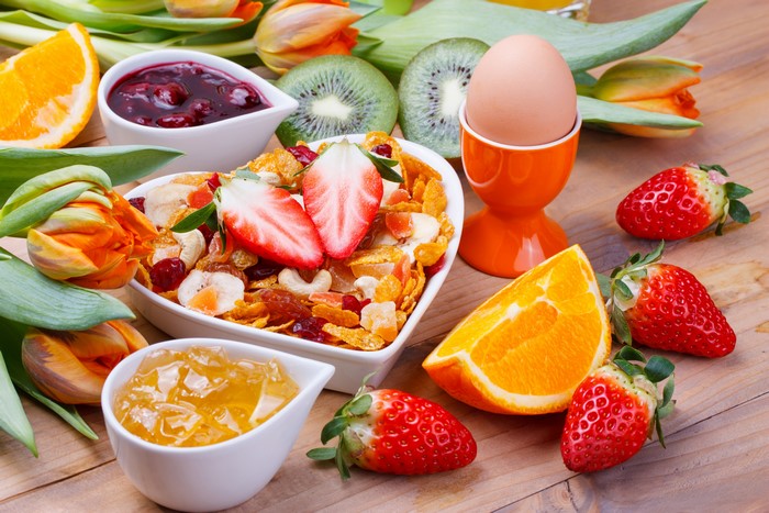 Still-life breakfast with muesli, fruit, and egg