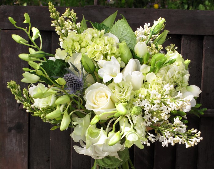 White and green floral bouquet with roses and lilac