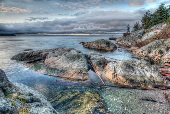 Rocky Coastline with Ocean and Clouds in Lighthouse Park, Canada