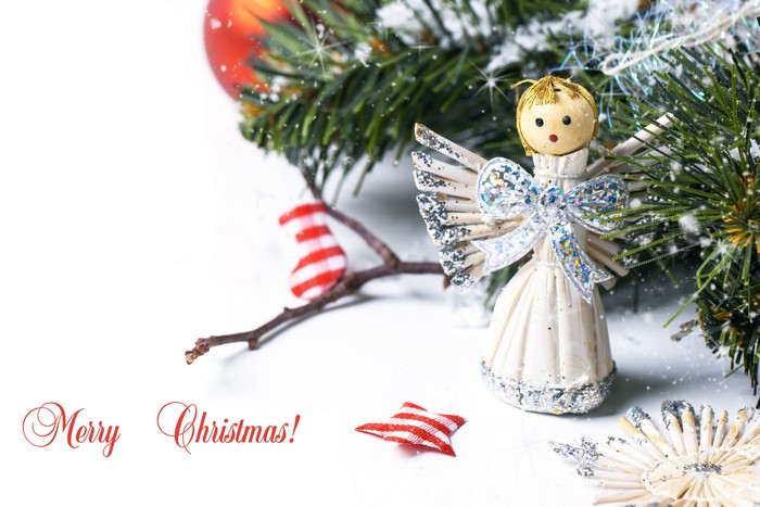 Christmas angel ornament with pine branches and red stocking