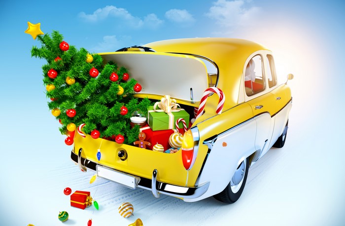 Christmas tree and gifts in a yellow car