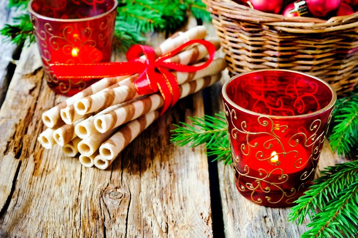 Christmas wafer cookies with candles and pine branches