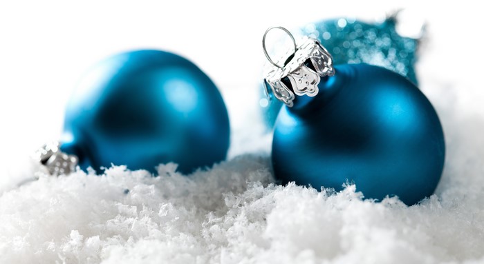Blue Christmas ornaments in snow