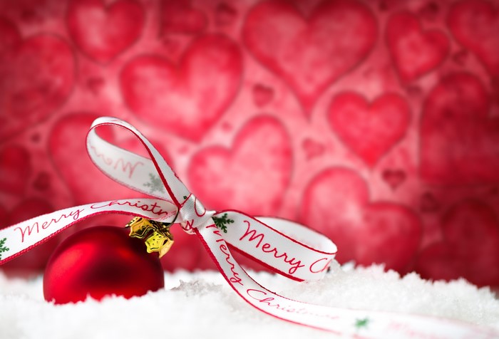 Christmas ornament with ribbon and snow