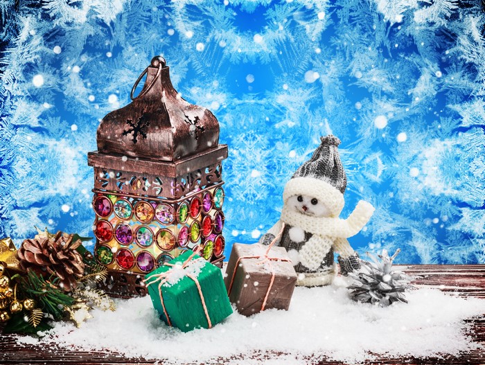 Christmas lantern with gifts and snowman