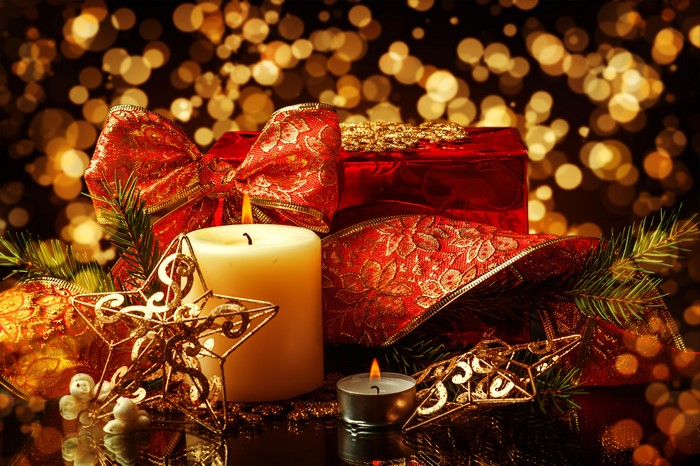 Christmas candles and gift with bokeh lights