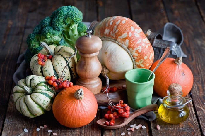 Still life with pumpkins, broccoli, and oil
