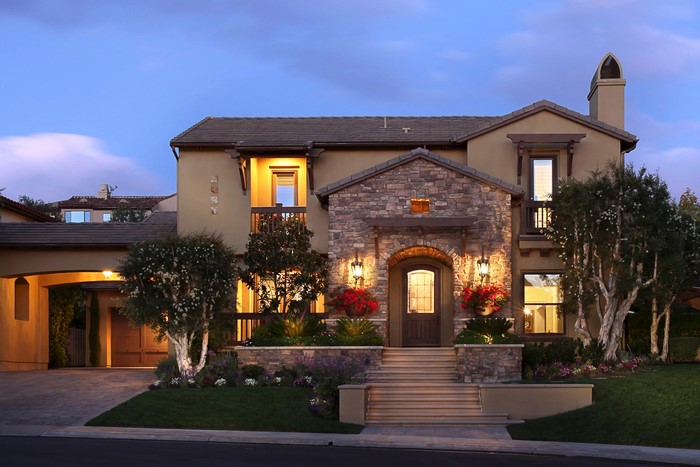Luxury house with stone facade and arched entryway