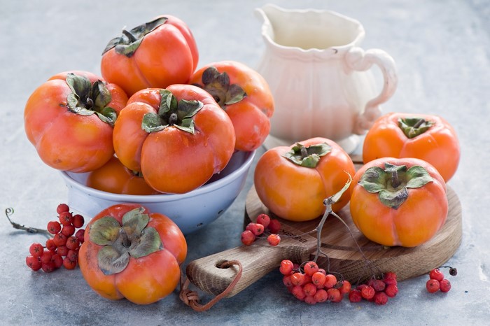 Persimmons and Rowan Berries with a Pitcher