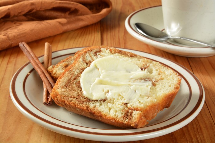Cinnamon Swirl Bread with Butter and Cinnamon Sticks