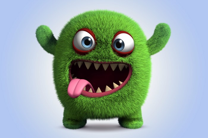 Green furry monster with big eyes and sharp teeth