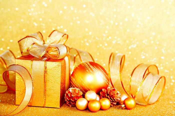 Golden Christmas Gift with Ornaments and Pine Cones