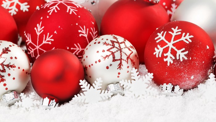 Christmas ornaments with snowflakes in snow