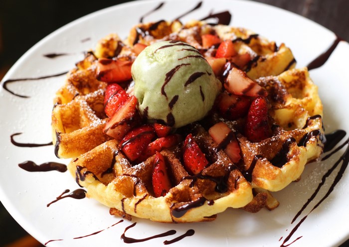 Waffle with strawberries and ice cream