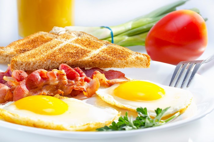 Breakfast with eggs, bacon, and toast