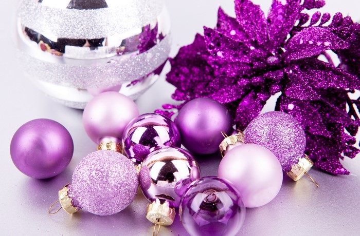 Purple and silver Christmas ornaments with glittery poinsettia