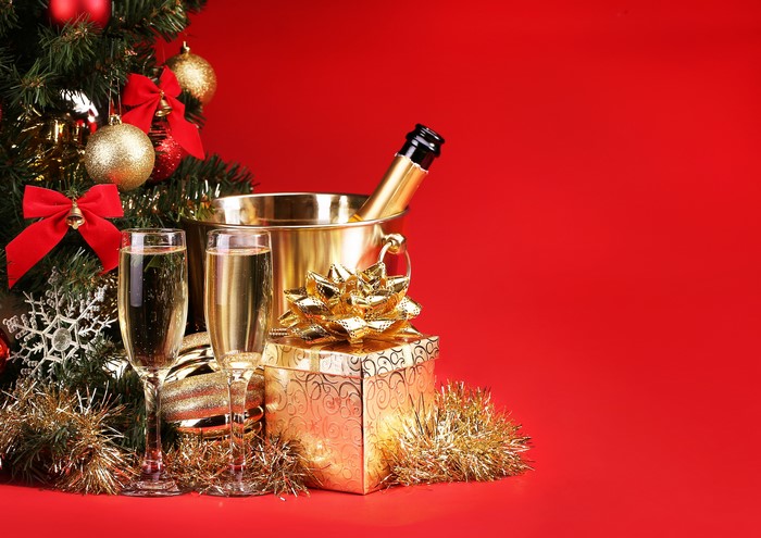 Champagne and Gifts by Christmas Tree