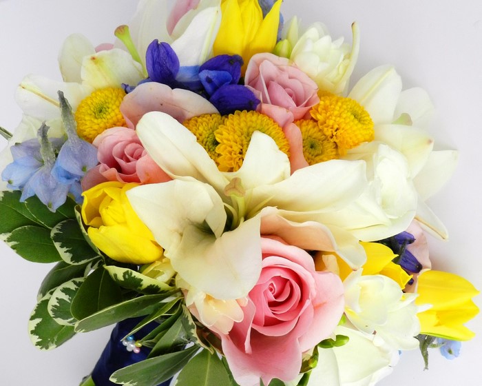Colorful bouquet of roses, lilies, tulips, and chrysanthemums