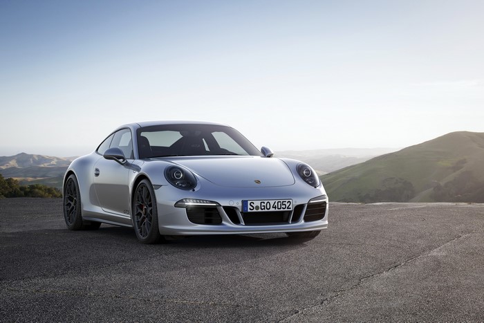 Silver Porsche 911 Carrera 4 GTS parked on a road