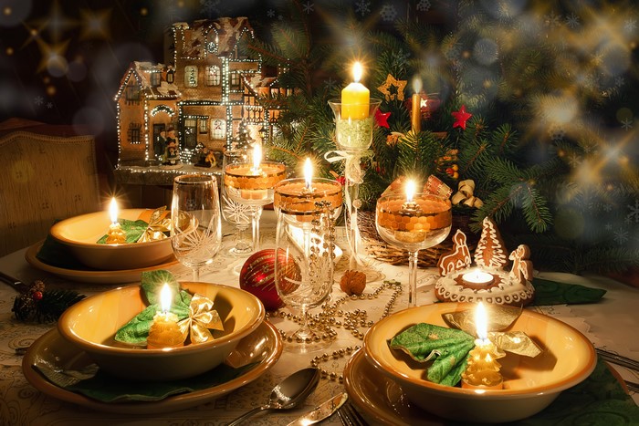 Christmas Table Setting with Candles and Gingerbread House
