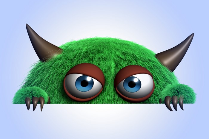 Green furry monster with horns and big eyes