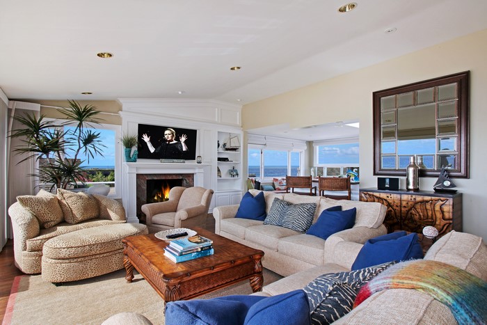 Living room with sofas, armchairs, and fireplace