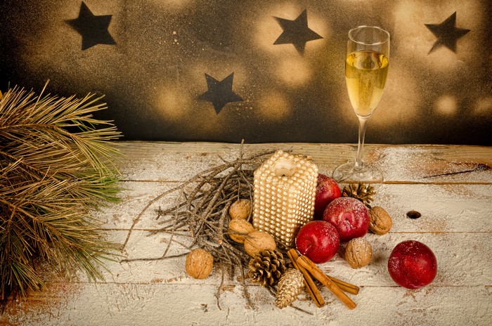 Christmas still life with champagne and pine cones