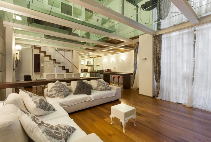 Modern loft living room with sofa and dining area