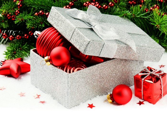 Christmas ornaments in a gift box with pine branches