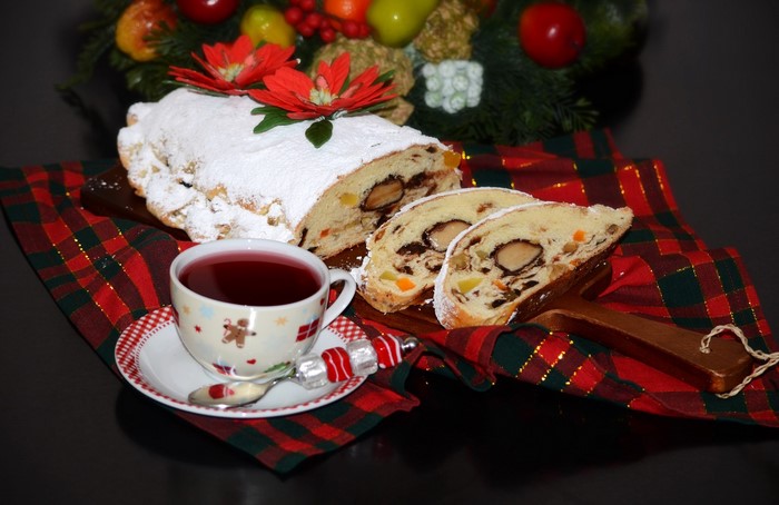 Christmas stollen with tea and festive decoration