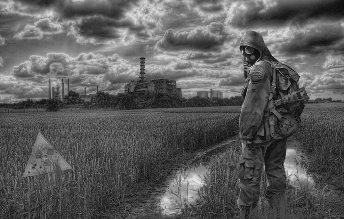 Man in gas mask and assault rifle in Chernobyl
