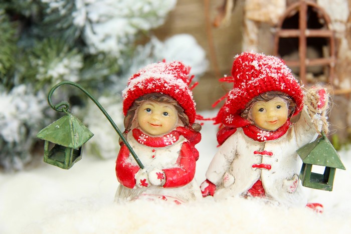Christmas figurines of two girls in snow