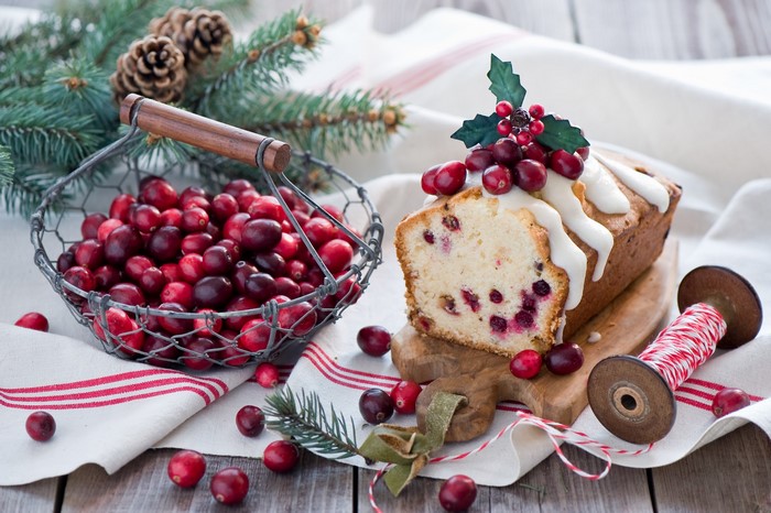 Cranberry loaf cake with icing and holly decoration