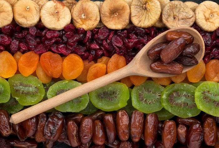 Assortment of dried fruits including figs, cranberries, apricots, kiwi, and dates