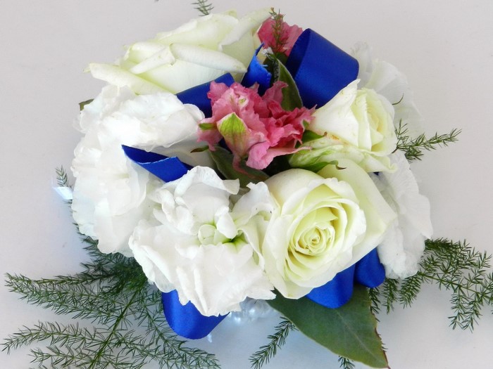 White roses and pink flowers corsage with blue ribbon