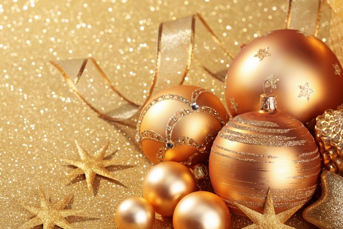 Christmas balls and stars on a gold background