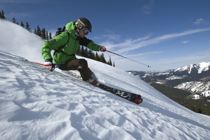 Man skiing down a snowy slope