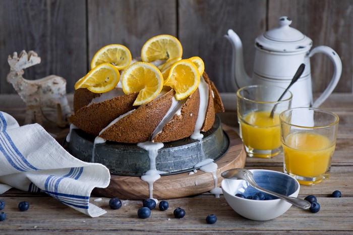 Bundt cake with orange slices and blueberries
