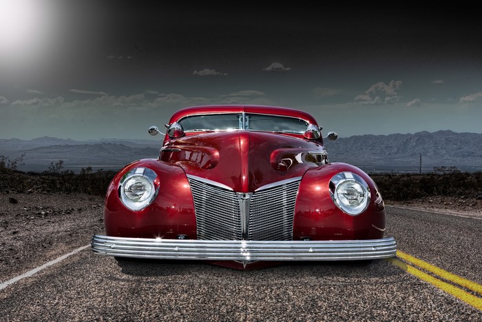 Red Ford hot rod on a desert road